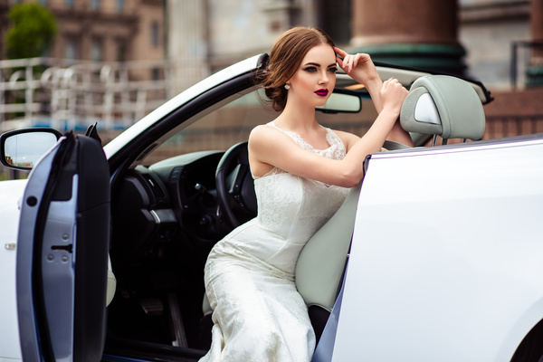 The beautiful bride sitting in a wedding car Stock Photo 05