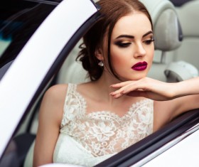 The beautiful bride sitting in a wedding car Stock Photo 06