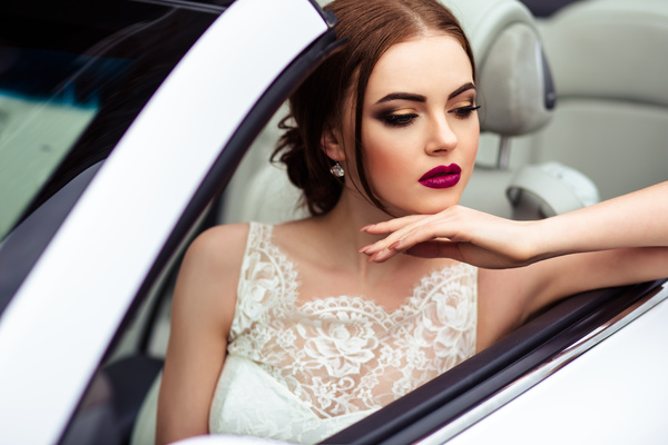 The beautiful bride sitting in a wedding car Stock Photo 06