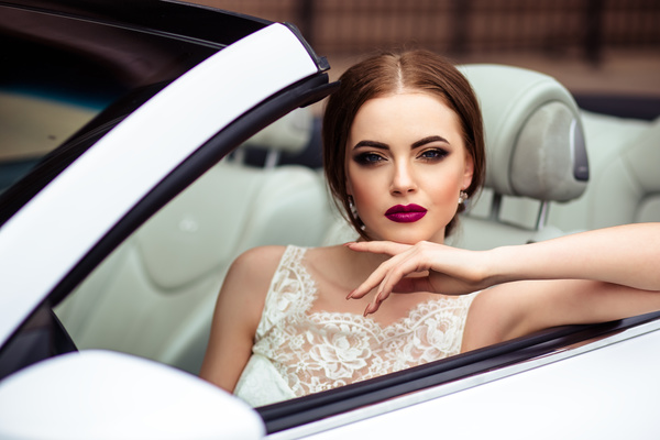The beautiful bride sitting in a wedding car Stock Photo 07