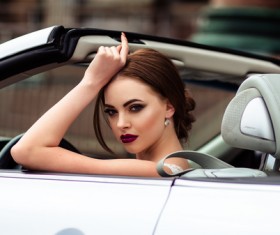 The beautiful bride sitting in a wedding car Stock Photo 08