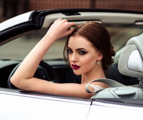 The beautiful bride sitting in a wedding car Stock Photo 09