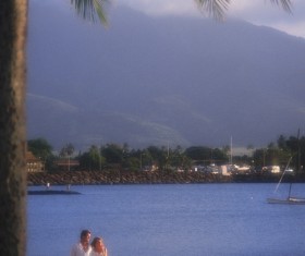 The couple walking on the beach Stock Photo