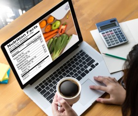 Use the computer to check your health diet recipes Stock Photo