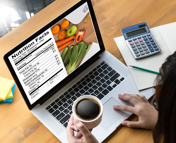 Use the computer to check your health diet recipes Stock Photo