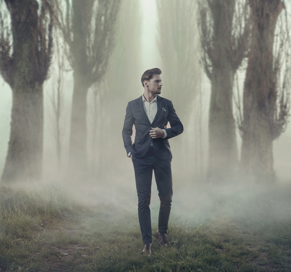 Walking handsome man in thick fog Stock Photo 02