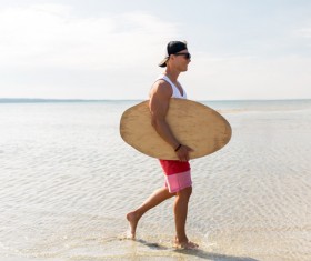 Walking on the beach man Stock Photo