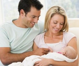 Watching young parents of newborn babies Stock Photo 01