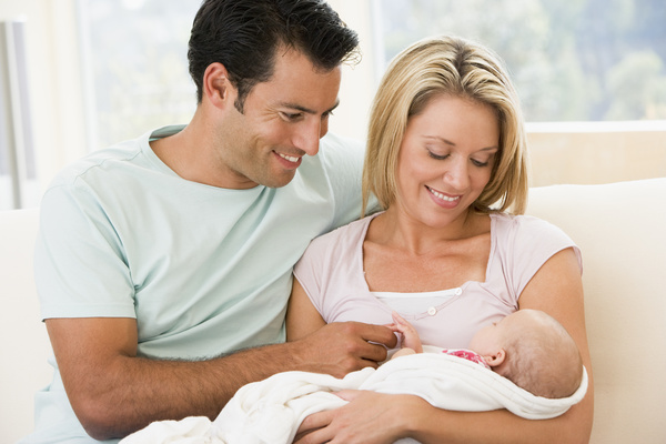 Watching young parents of newborn babies Stock Photo 01