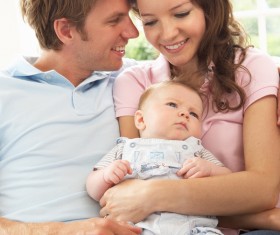 Watching young parents of newborn babies Stock Photo 02