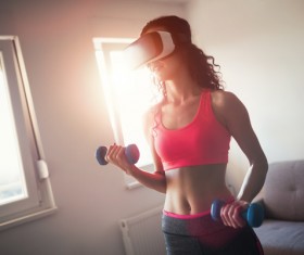 With VR glasses fitness woman Stock Photo