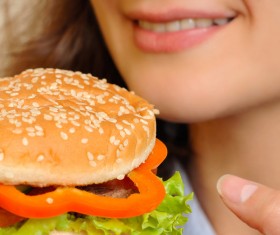 Woman eating hamburger Stock Photo 01