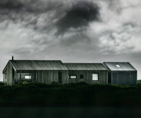 Wooden cottages under cloudy sky Stock Photo