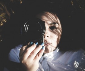 Young girl posing with camera Stock Photo