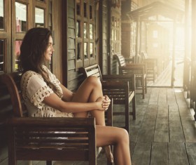Young girl sitting on a bench to rest Stock Photo 01