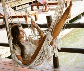 Young girl sitting on a hammock Stock Photo 03