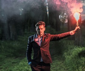 Young man holding fireworks Stock Photo