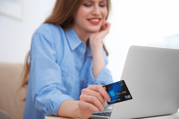 Young woman shopping online at home Stock Photo 02