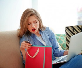 Young woman shopping online at home Stock Photo 06