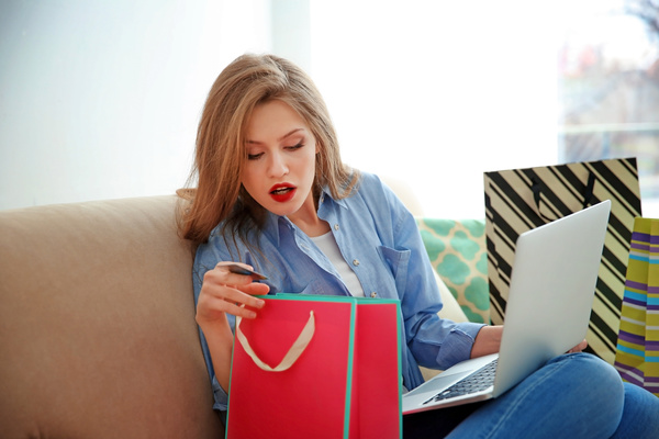 Young woman shopping online at home Stock Photo 06