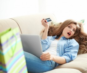 Young woman shopping online at home Stock Photo 08