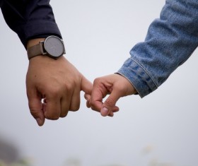 closeup romantic lovers hand hand Stock Photo