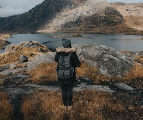 female tourist on mountain lake landscape Stock Photo