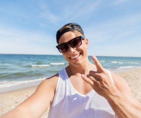 man smiling at the beach Stock Photo