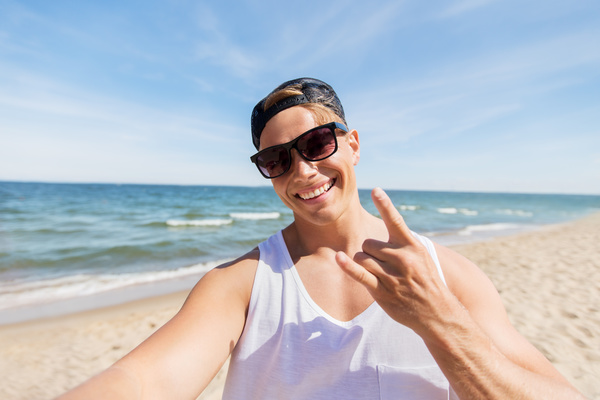 man smiling at the beach Stock Photo