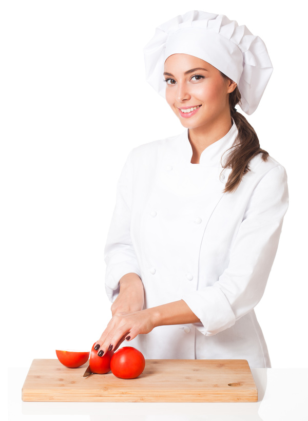 woman chef who cuts tomatoes Stock Photo
