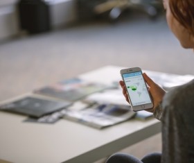 woman who plays mobile phones in the Office Stock Photo