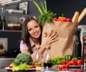 young woman who cooks in the kitchen Stock Photo 04