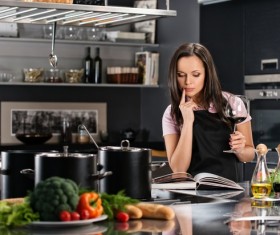 young woman who cooks in the kitchen Stock Photo 09