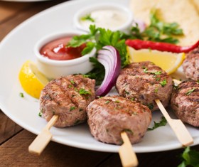 A plate of barbecue and onion lemon Stock Photo