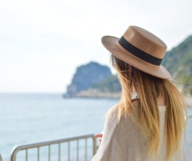 Beautiful blonde girl posing with hat Stock Photo