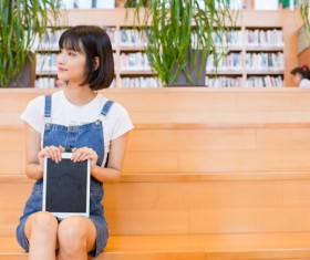 Beautiful girl in the library Stock Photo