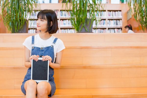 Beautiful girl in the library Stock Photo