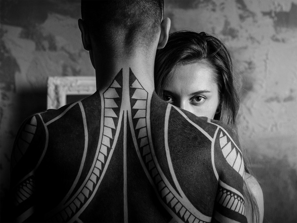 Black white picture of stylish couple with tattoo Stock Photo