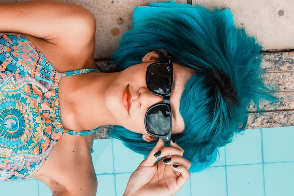 Blue hair with sunglasses woman Stock Photo