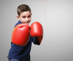 Boxing movement of the little boy Stock Photo