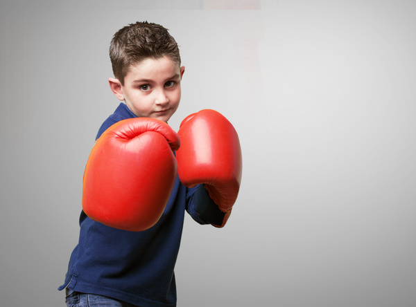 Boxing movement of the little boy Stock Photo