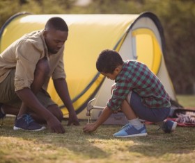 Father and son together with the tent Stock Photo