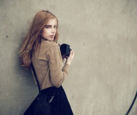 Holding the camera beautiful girl Stock Photo