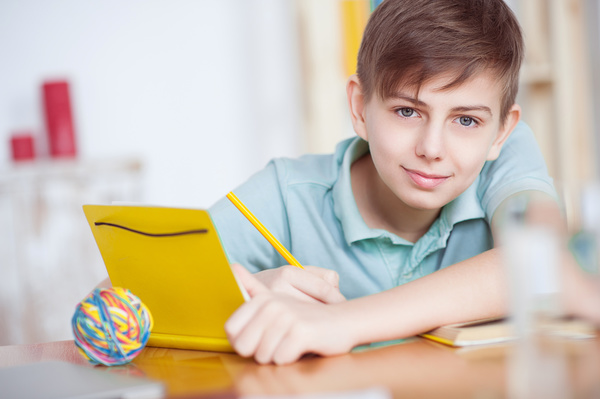 Little boy writing homework Stock Photo