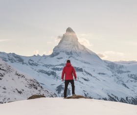 Looking at the distant snow mountain man Stock Photo