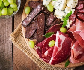 Meat sausage with cheese grapes Stock Photo