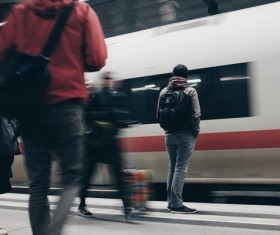 Pedestrian waiting by fast train Stock Photo