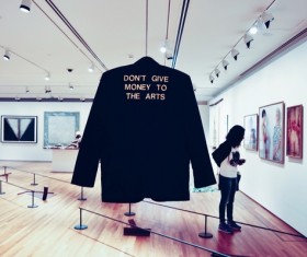 People in artistic painting gallery Stock Photo