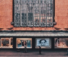 People walking near gaudy decorated building Stock Photo