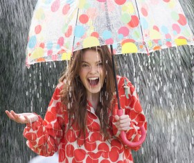 Rainy woman with umbrella happy Stock Photo 02